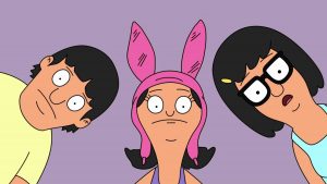 From left to right: Gene, Louise, and Tina Belcher from Bob's Burgers, looking down with purple background.