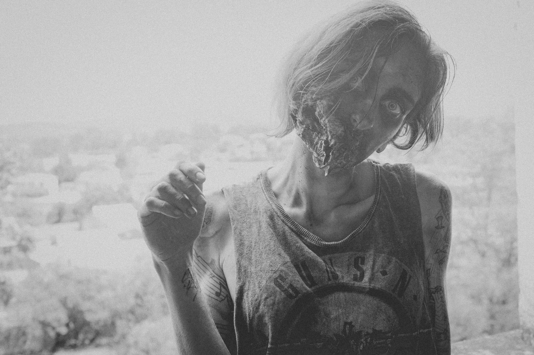 Young woman in zombie makeup, black and white. 