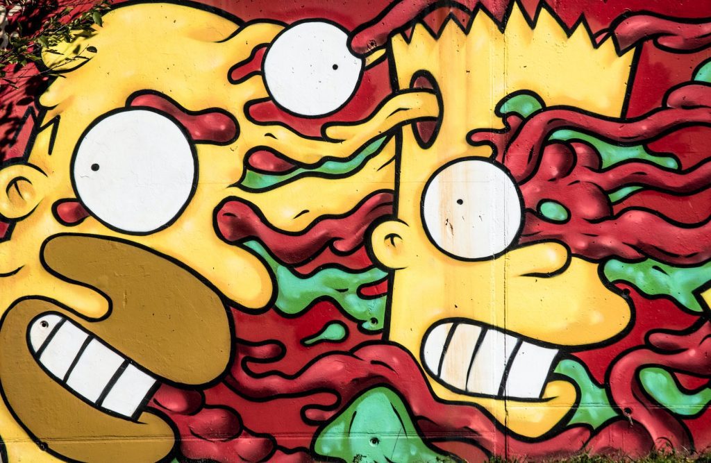 Abstract graffiti of Bart and Homer Simpson with their faces appearing to melt into one another's amid blue and red slime/tendrils.