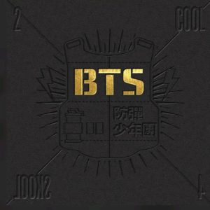 Album cover for 2 Cool 4 Skool by BTS, black embossed background with gilded lettering.