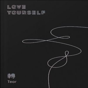 Album cover for Love Yourself: Tear with white text and abstract lines over black background.