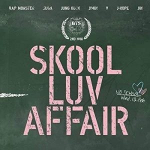 Album cover for Skool Luv Affair by BTS, blackboard background with pink stenciled chalk typography. 