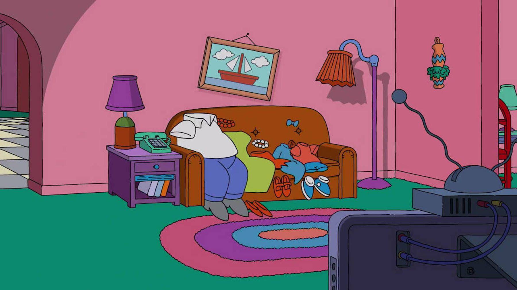 A Simpsons couch gag with only the characters' clothes on the sofa. 