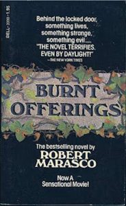 Cover for horror novel Burnt Offerings by Robert Marasco featuring illustrative leaves and text against dark background.