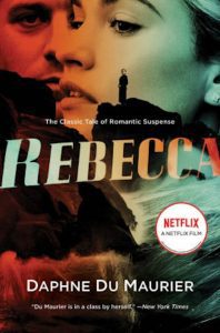 Cover for Rebecca by Daphne du Maurier, with a composite of a man and woman in red, orange, and green behind a silhouette of a figure on a cliff. 