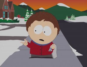 Clyde Donovan standing on sidewalk in South Park staring at hand. 