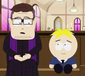 Father Maxi sitting in the pew of a church with Butters.