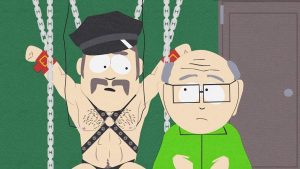 Mr. Garrison talks to Mr. Slave, who is chained to a wall.