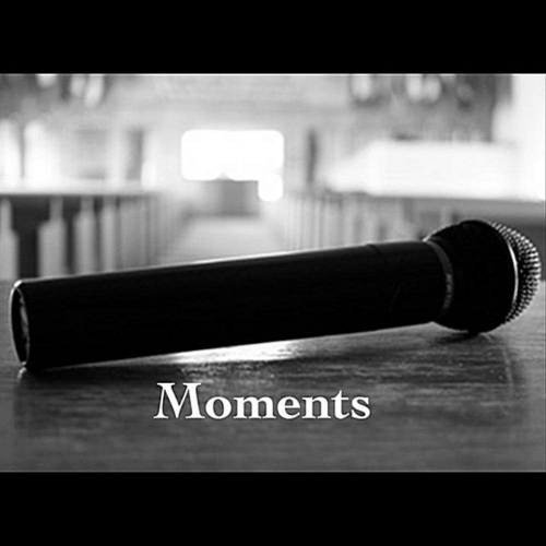 Moments by Nate Feuerstein album cover art. Black and white image of a microphone on a table with blurred church pews in the background. 