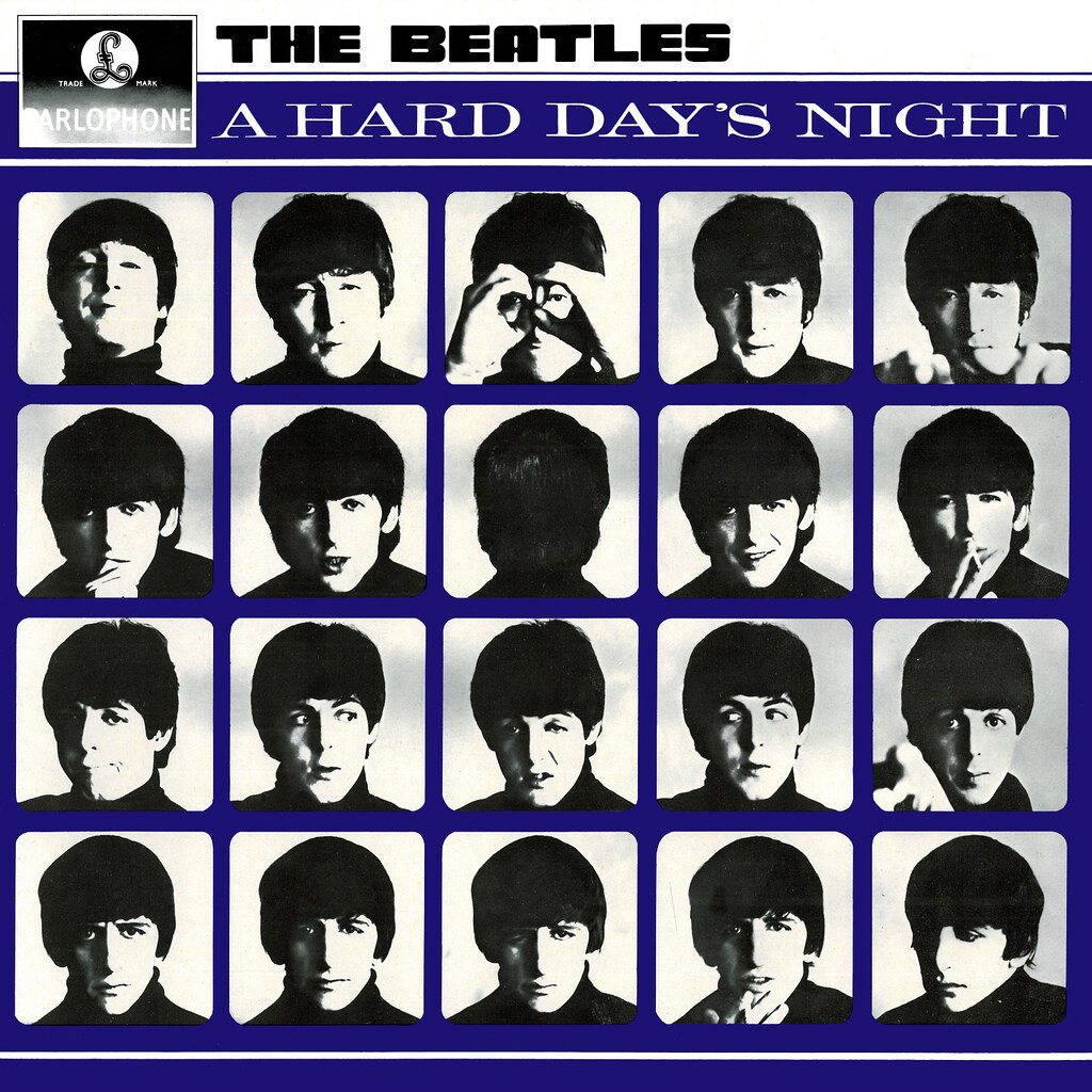 "A Hard Day's Night" by The Beatles. Various back and white headshots of the members fill the entire album cover with a blue grid background
